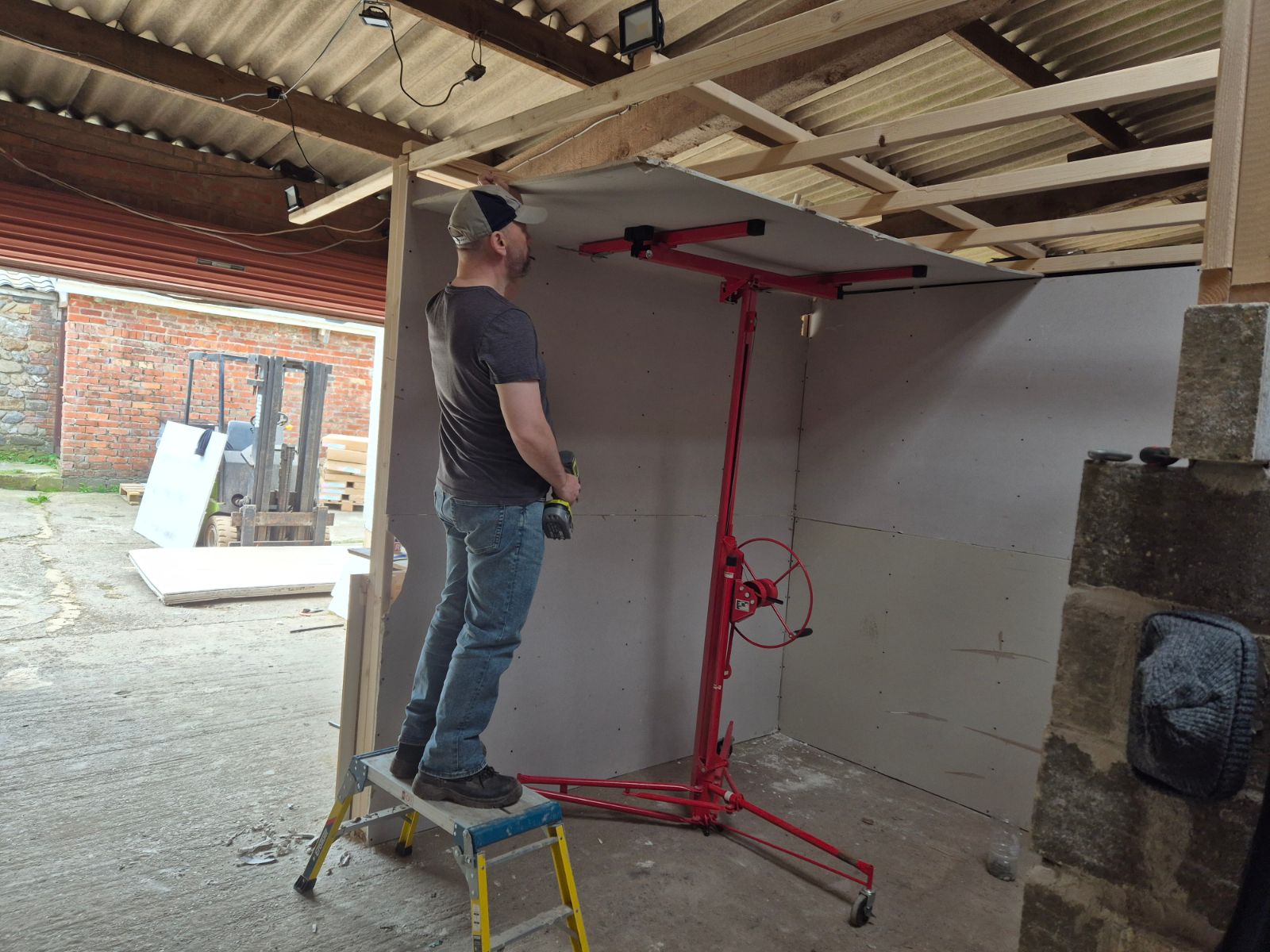 Learner working on plasterboarding during practical Plastering training